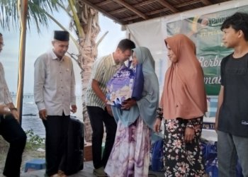 PT. Pelsart Tambang Kencana Gandeng PWI Kotabaru Bagikan Paket Lebaran