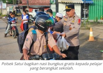 Program Jumat Berkah, Polsek Satui Bagikan 400 Nasi Bungkus Gratis