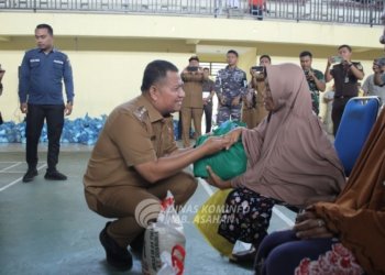 Pemerintah Kabupaten Asahan Menyerahkan Bantuan Beras Kepada 1000 Kaum Dhuafa