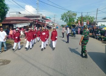 Pastikan Kemanan Dan Ketertiban, Babinsa Kusan Hilir Pantau Kegiatan Lomba Gerak Jalan