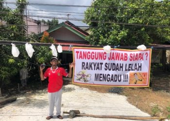 Warga Jembatan Sei Ulin Protes Kabel Menjuntai, Spanduk Dipasang karena Tak Kunjung Ditindaklanjuti