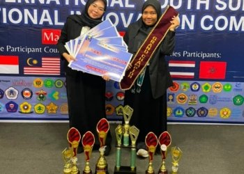 Mahasiswa Farmasi ULM Renanda dan Naisya Raih Grand Champion di Kuala Lumpur